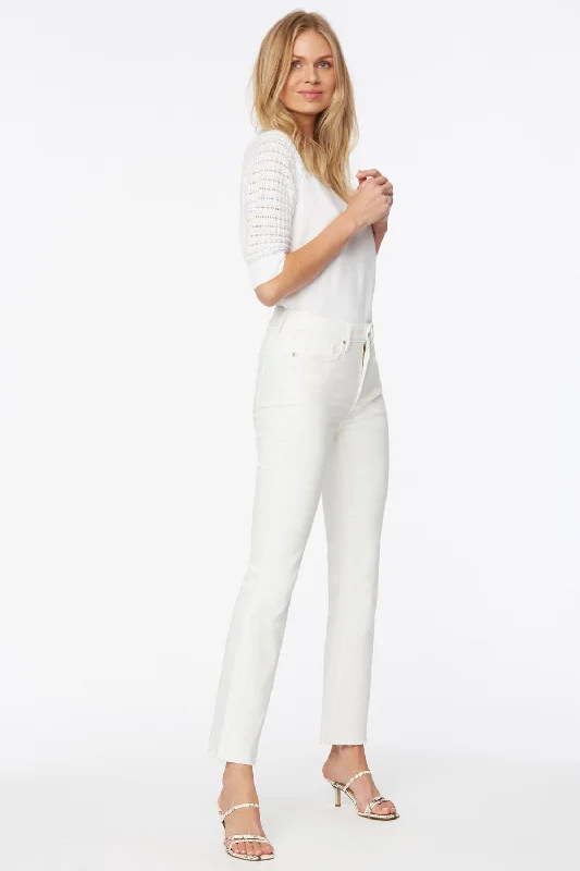 Colored women jeans in vibrant hues like red and yellowSlim Bootcut Ankle Jeans In Petite - Optic White